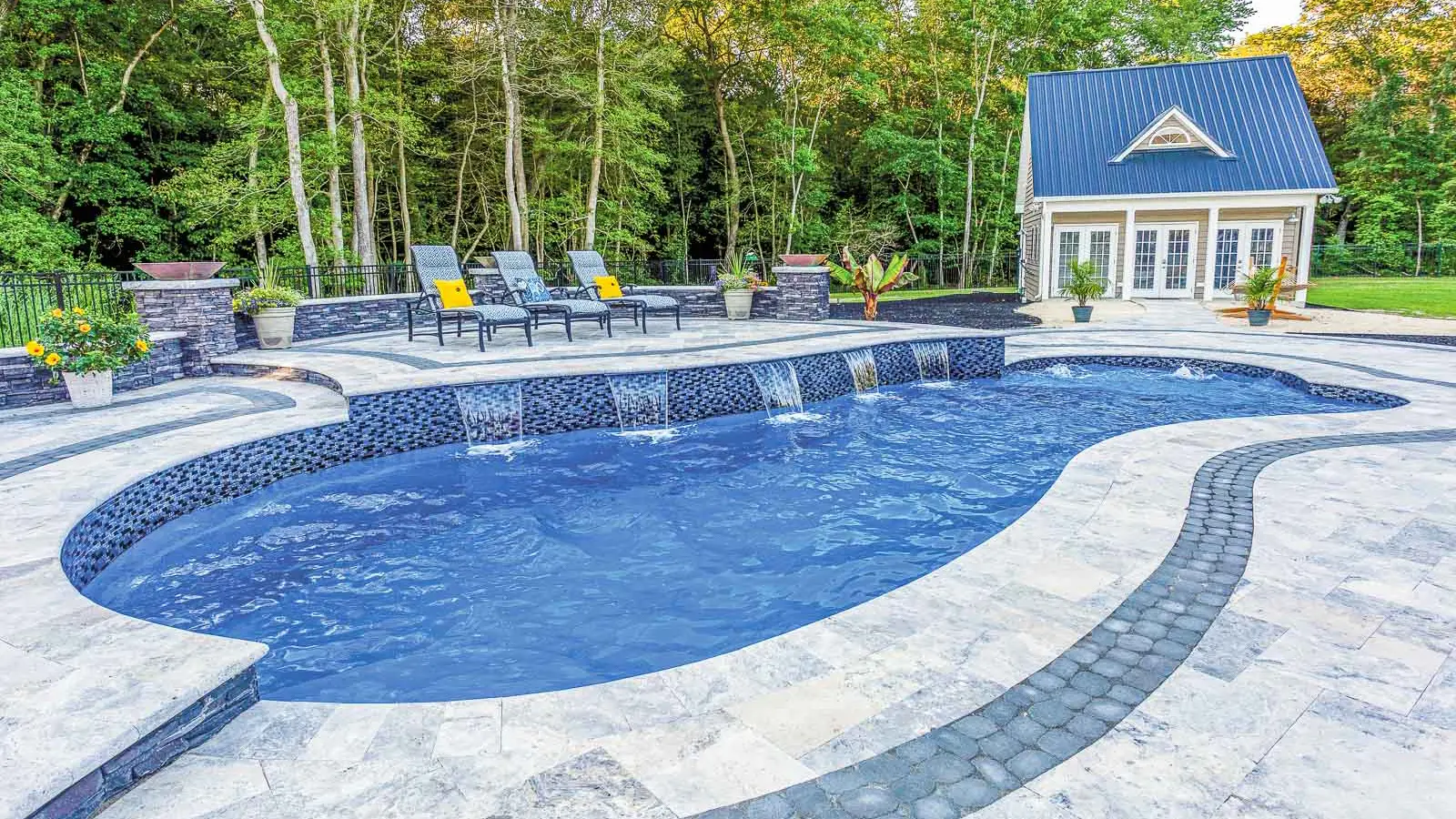 The Eclipse, a freeform fiberglass pool with a generous splash pad entrance