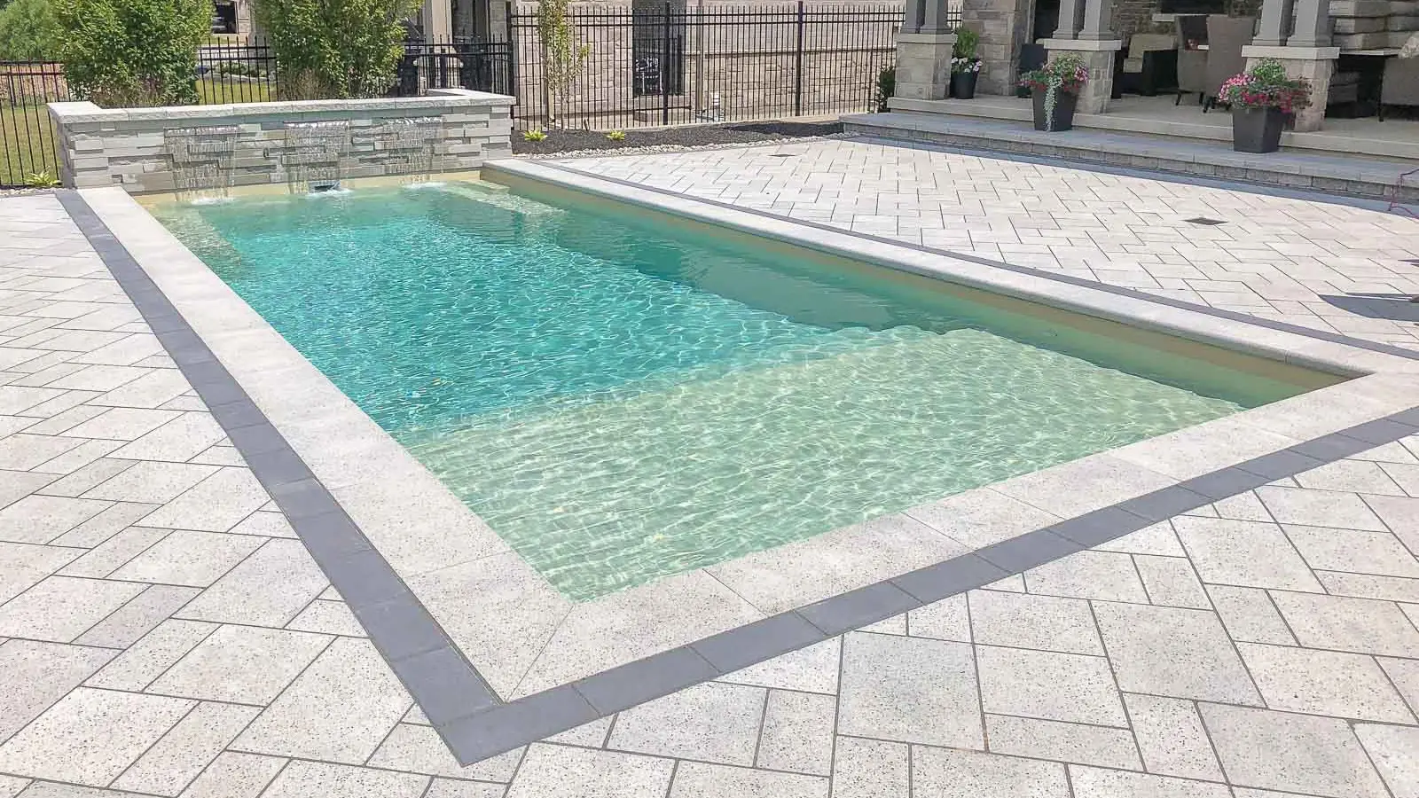 The Summit, a fiberglass pool with a full width splash pad